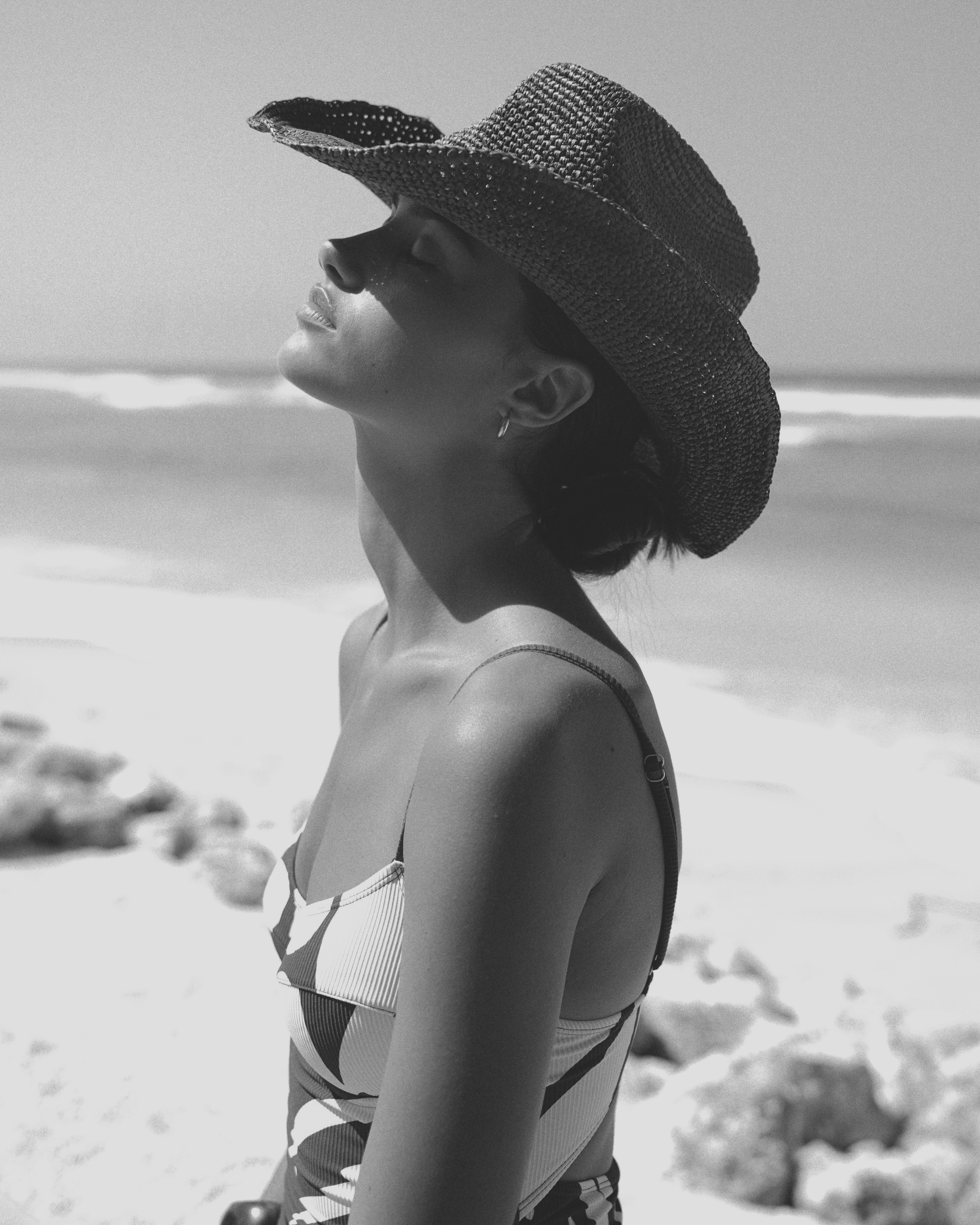 Lightweight straw cowboy hat for women, adjustable fit, perfect for summer beachwear and resort style.