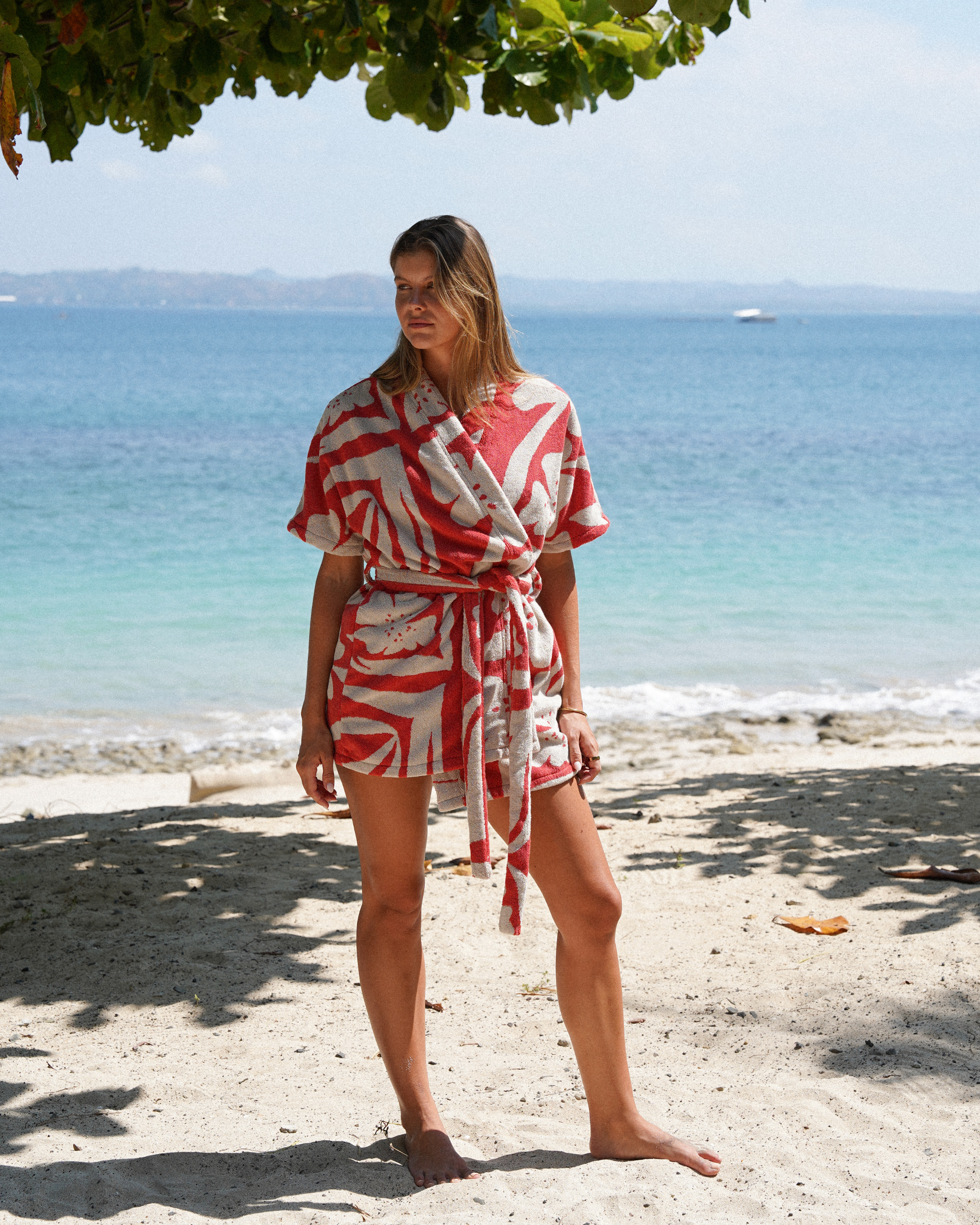 Close-up of the Solana robe in watermelon floral towelling fabric, highlighting its plush texture, vibrant print, and premium finish—designed for elevated everyday lounging or holiday wear.
