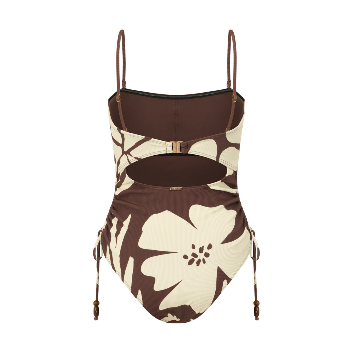 Back view of a brown and cream floral print one-piece swimsuit with a cut-out back, ring buckle closure and ruched side-tie detail, studio flat lay