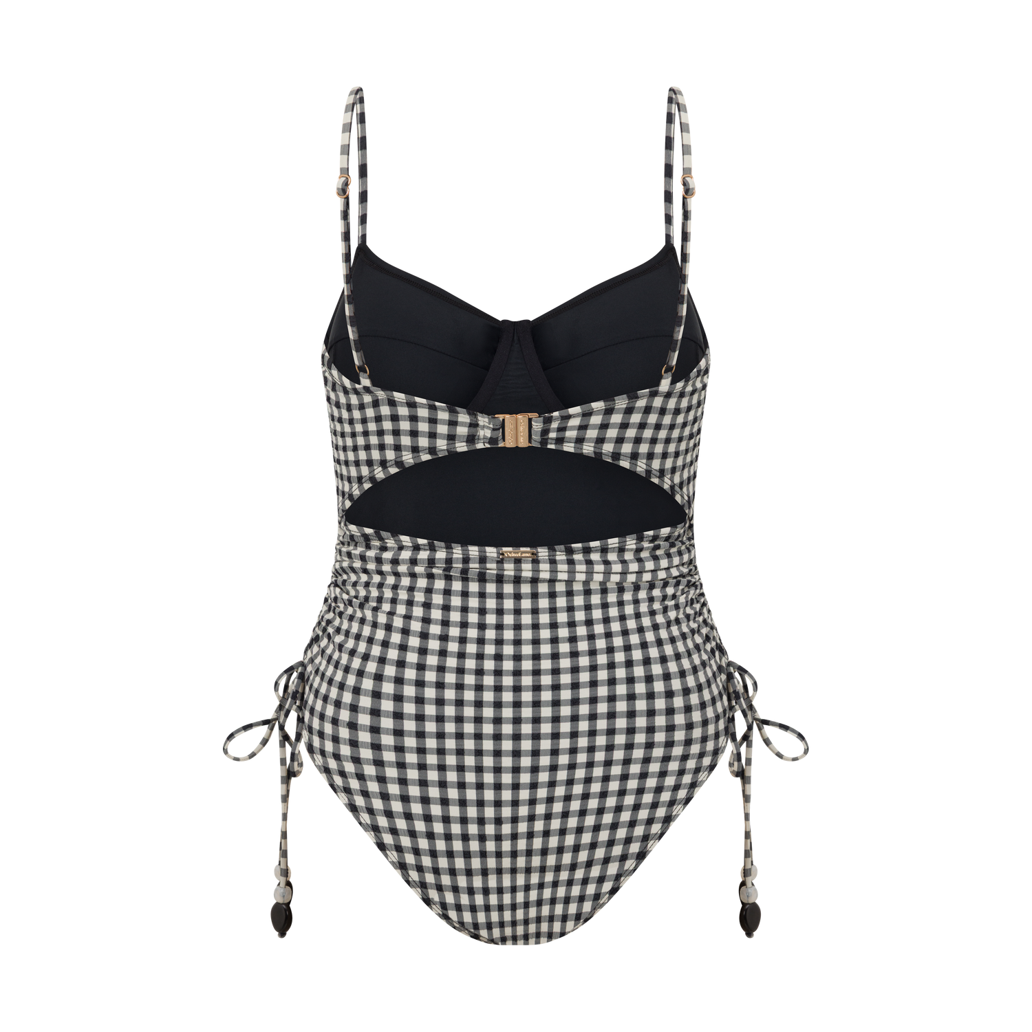 Thin Strap Underwire One Piece in black and cream gingham seersucker, captured by the ocean for elevated beachwear style.