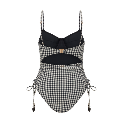 Thin Strap Underwire One Piece in black and cream gingham seersucker, captured by the ocean for elevated beachwear style.