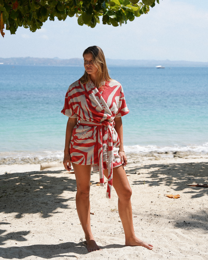 Close-up of the Solana robe in watermelon floral towelling fabric, highlighting its plush texture, vibrant print, and premium finish—designed for elevated everyday lounging or holiday wear.