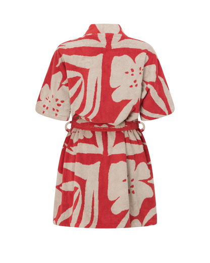 Back view of the Solana towelling robe in red floral print, featuring Ochre Lane’s signature relaxed silhouette, absorbent cotton fabric, and modern resortwear shape.

