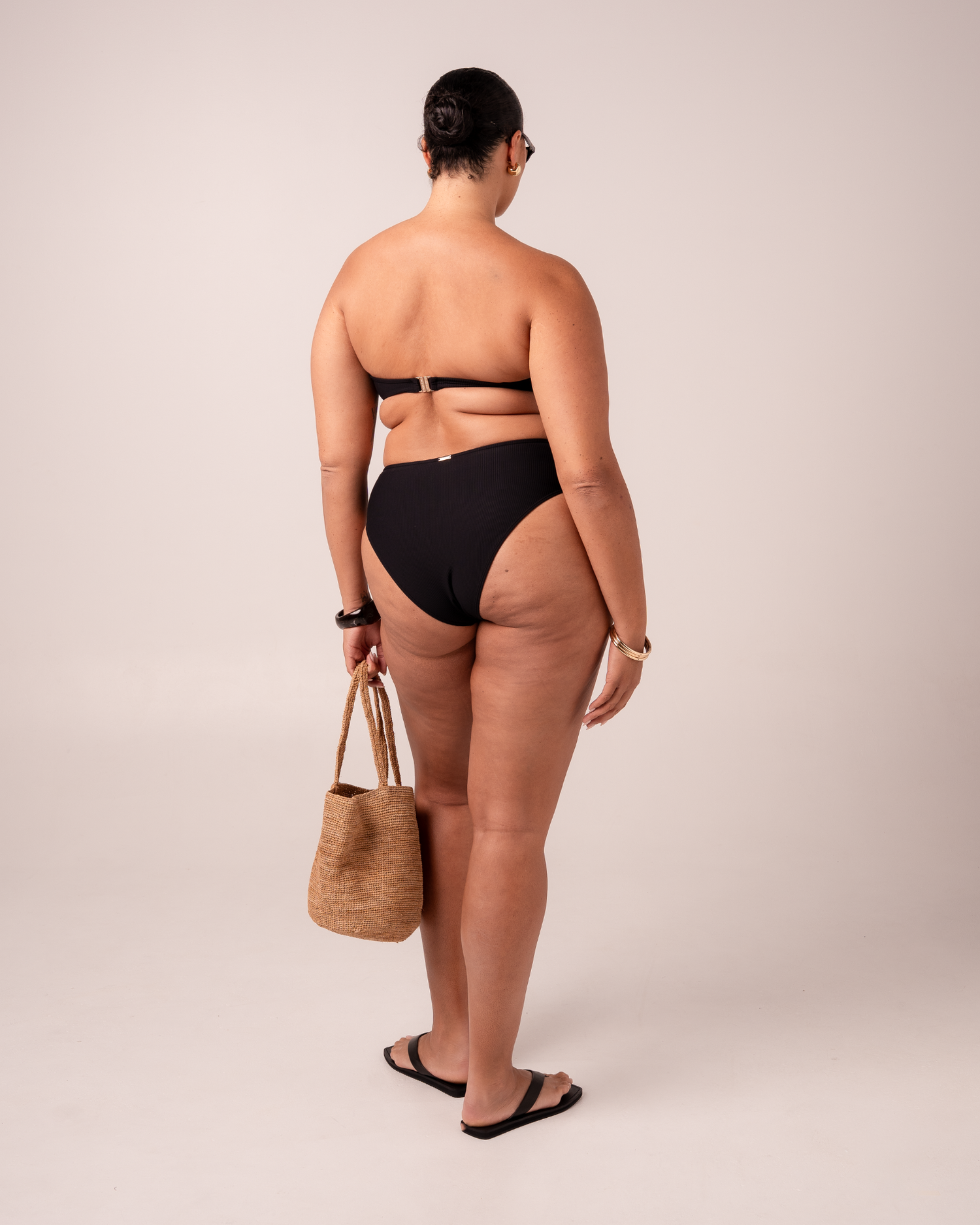 Ochre Lane Bandeau Twist bikini top in black rib with supportive twist front and removable straps