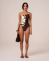 Chocolate brown ribbed one-shoulder swimsuit with cream floral panel and ruched side tie, front view