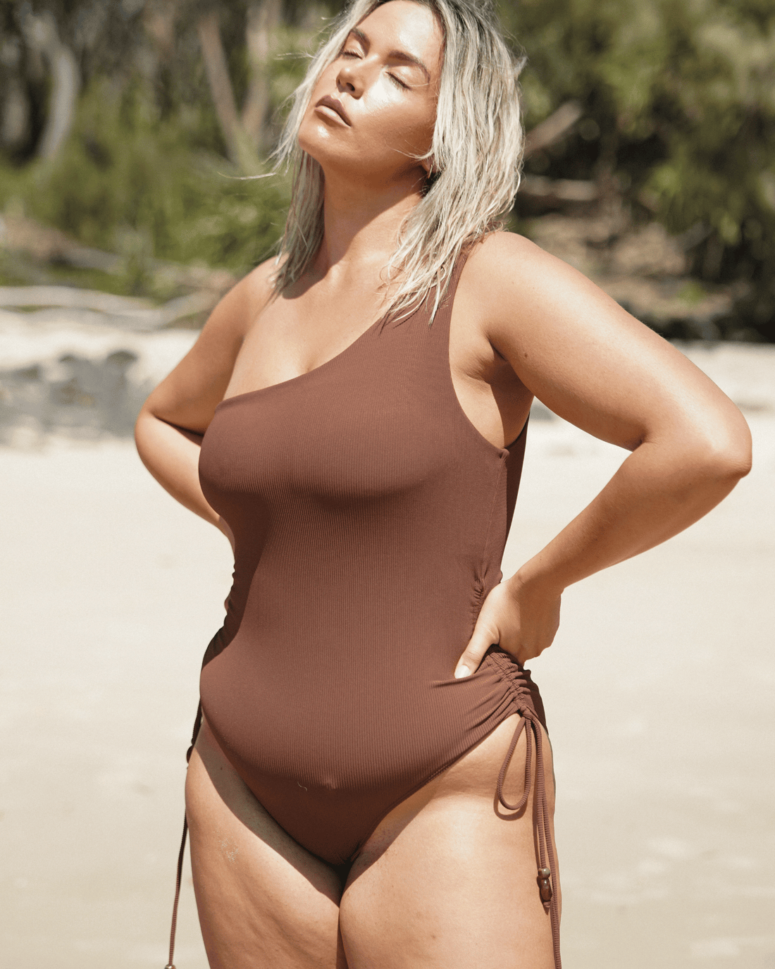 Ochre Lane One Shoulder Ruched One Piece in chocolate brown rib with sculpting rib fabric and flattering high-leg cut