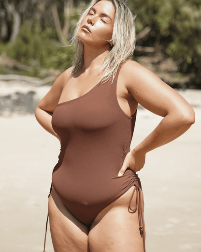 Ochre Lane One Shoulder Ruched One Piece in chocolate brown rib with sculpting rib fabric and flattering high-leg cut
