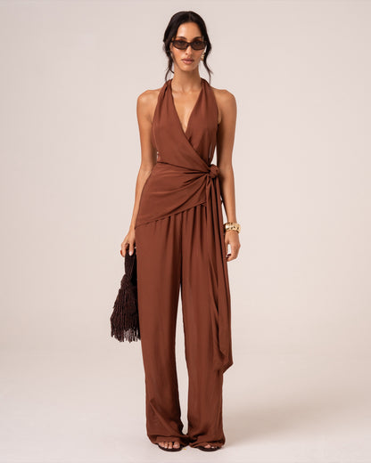 Front view of a chocolate brown halter wrap top showing the plunging V-neckline and side waist tie