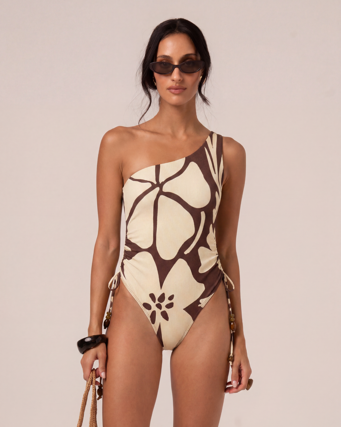 One Shoulder Ruched One Piece in Ibisco floral print with adjustable beaded side ties and flattering high-leg cut