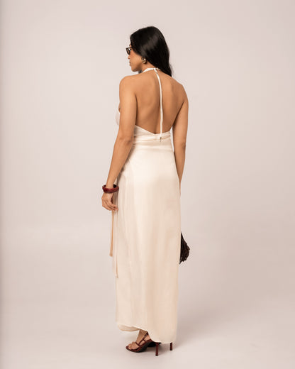 Back view of an ivory halter wrap maxi dress showing the deep open back and self-tie halter neck