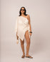 Ivory resort cape with fluid batwing sleeves and an angled draped hem, layered for honeymoon evenings