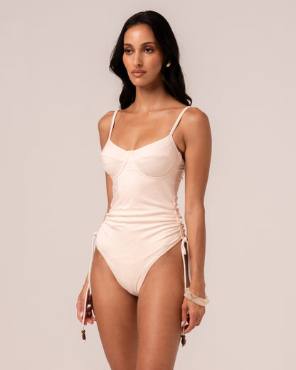 Close-up of the ivory jacquard rib fabric on the underwire one piece showing the woven floral motif — true to colour fabric detail