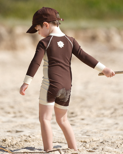 Kids rib chocolate long-sleeve surfsuit for sun protection by Ochre Lane