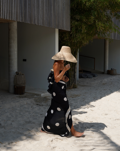 Ochre Lane Noir Dot Sarong in black polkadot print, a lightweight resort beach cover-up