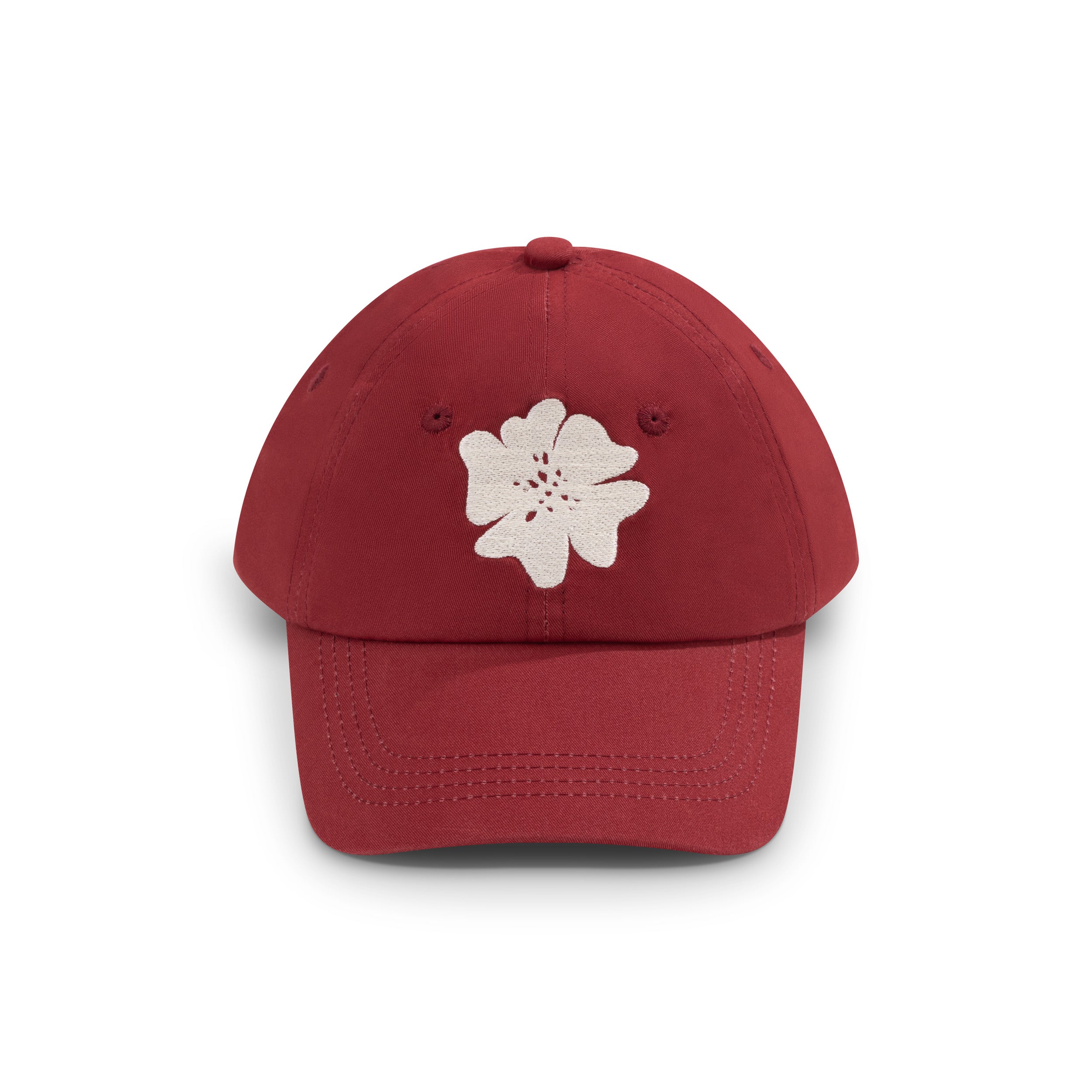 Red kids baseball cap with embroidered white flower logo, front view
