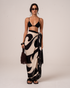 Ochre Lane Soleil Sarong in black and cream abstract print, a lightweight beach cover-up over swimwear