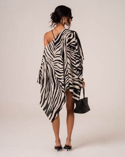 Back view of a zebra print sheer resort cape showing the soft cascading points