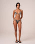 Model wearing a zebra print string triangle bikini top with a wooden bead centre detail and thin adjustable straps, paired with matching tie-side bottoms, studio front view